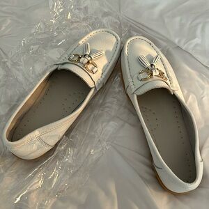 Brand new, white leather loafers. Gum, soul, padded inside.